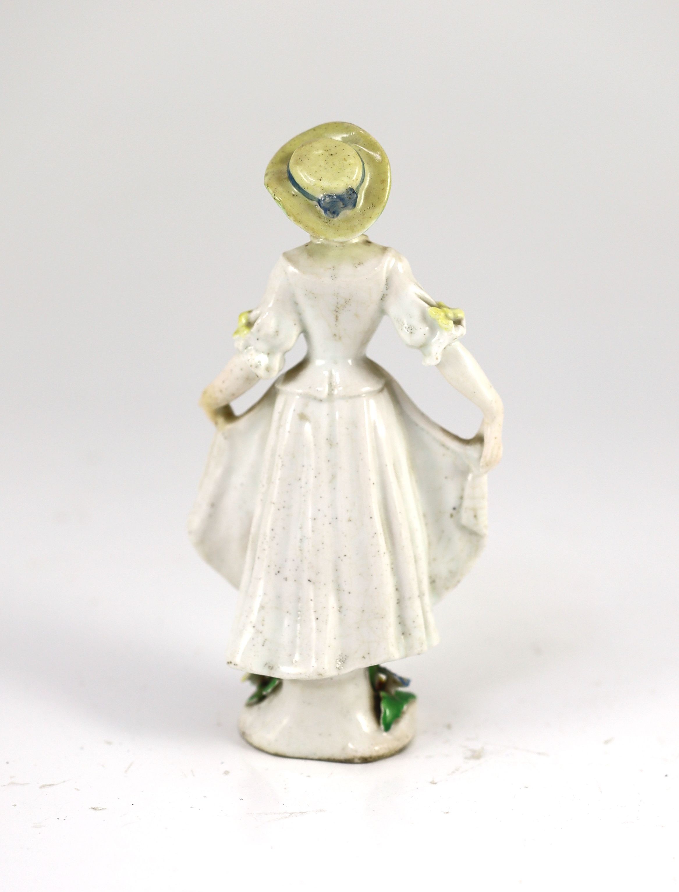 A rare Chelsea figure of a dancing girl, c.1752-55, probably modelled by Joseph Willems, 16 cm high, discoloured restoration